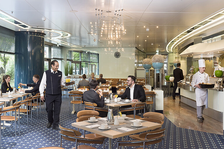Ambiente Restaurant with front cooking  Guests enjoying breakfast at the stylish Ambiente restaurant at Maritim Hotel Frankfurt.