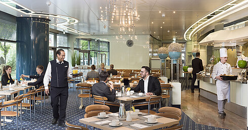 Ambiente Restaurant with front cooking  Guests enjoying breakfast at the stylish Ambiente restaurant at Maritim Hotel Frankfurt.