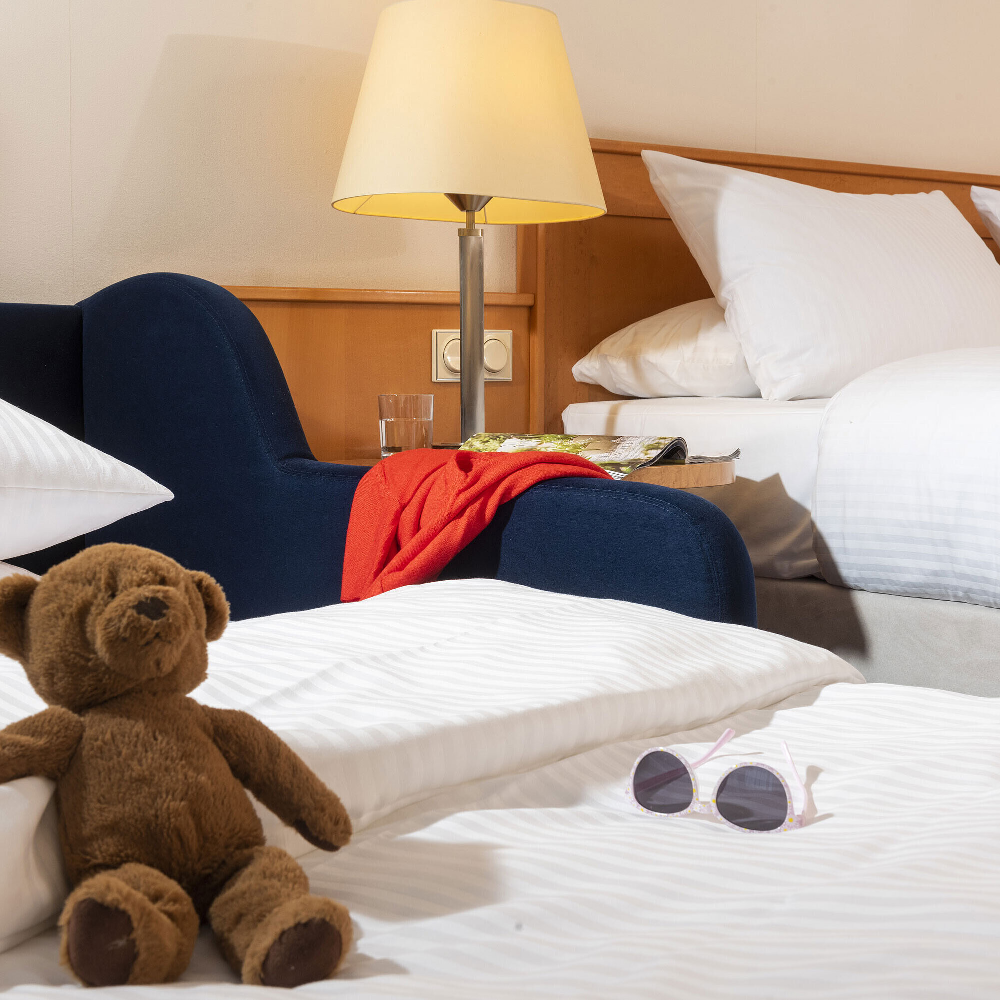 Classic Family room Cozy family room at Maritim Hotel Frankfurt with a teddy bear, sunglasses, and soft beds for a relaxing stay.