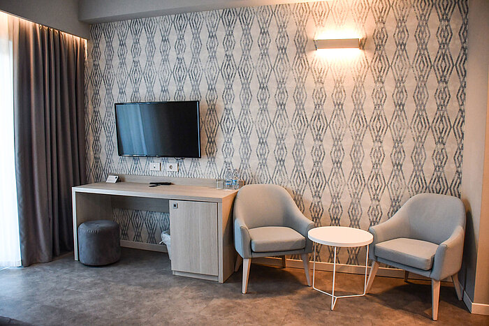 Standard room Modern seating area with TV and desk in the room at Maritim Resort Calabria