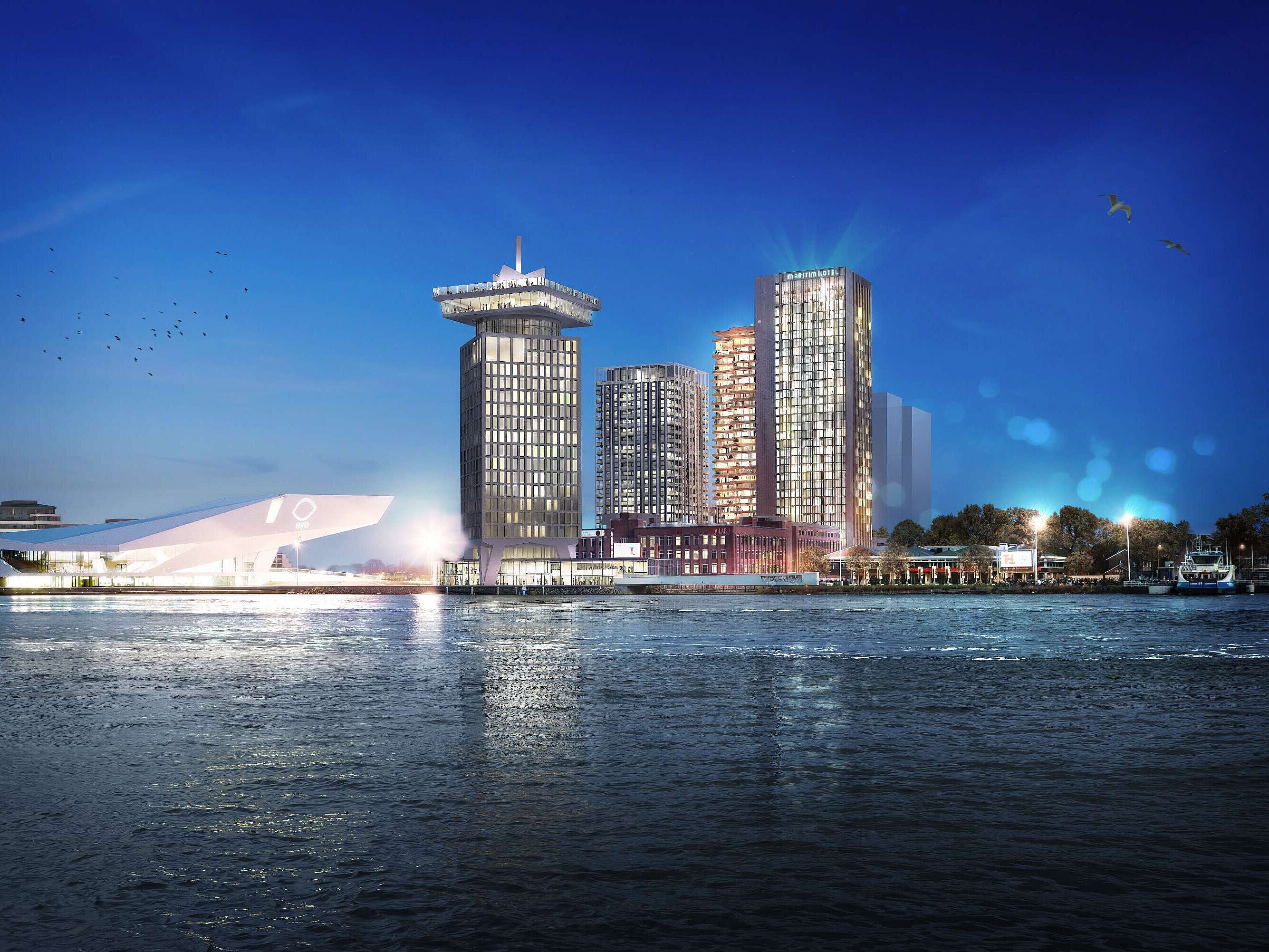Maritim Hotel Amsterdam at night with skyline view and the IJ river