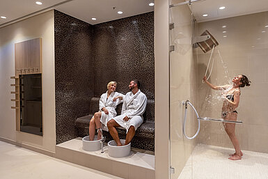 Wellness area at Maritim Hotel Ingolstadt with foot baths, experience shower, and relaxing atmosphere.