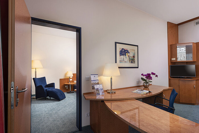 Comfort Family room Comfort family room at Maritim Hotel Frankfurt with separate living and sleeping areas, desk, and stylish interior.