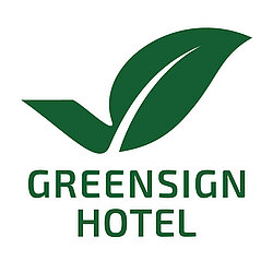 Greensign Hotel logo with green leaf symbol on white background