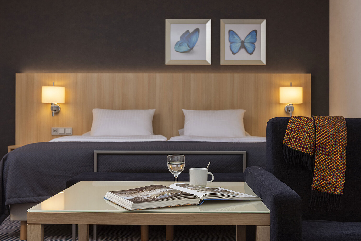 Bright Superior family room at Maritim Hotel Würzburg with sofa, double bed and city view
