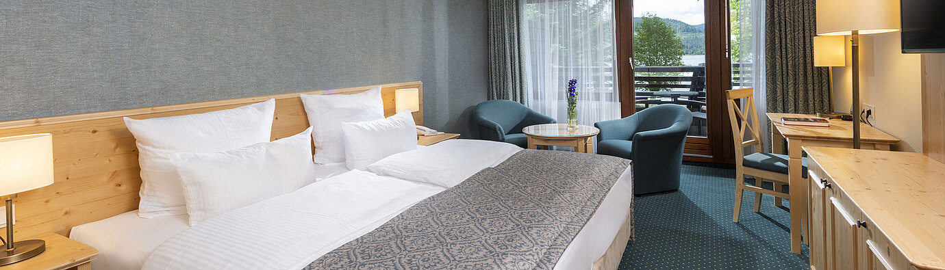Modern hotel room at Maritim Hotel Titisee with balcony and lake view