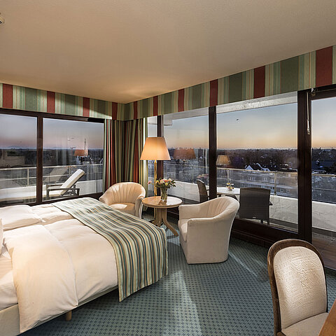 Superior room at Maritim Seehotel Timmendorfer Strand with sea view, double bed, seating area, and balcony.