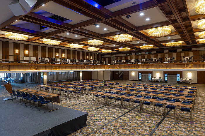 Large hall with view of seating rows and gallery at Maritim Hotel Travemünde