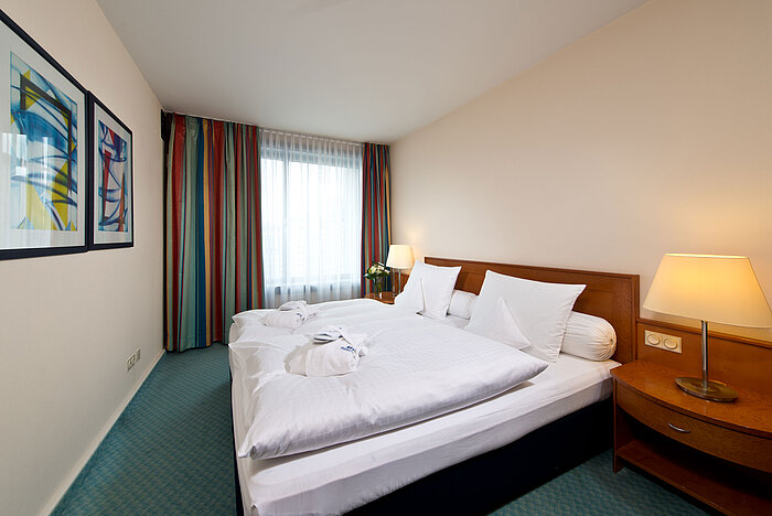 Master suite  Bedroom of the master suite at Maritim Hotel Frankfurt with double bed, modern furnishings, and relaxing ambiance.