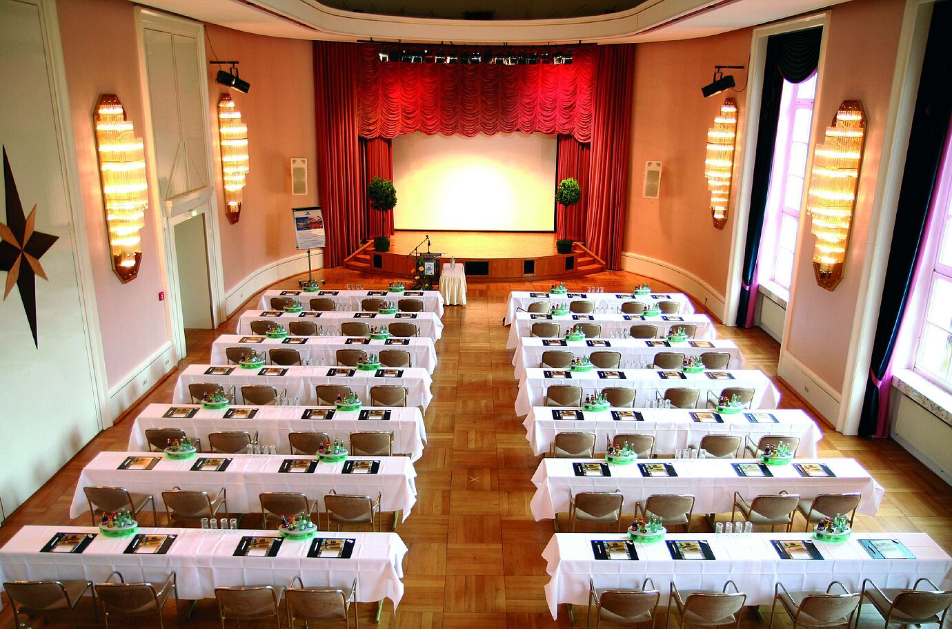 Historic lecture hall at Maritim Hotel Bad Wildungen with stage and daylight