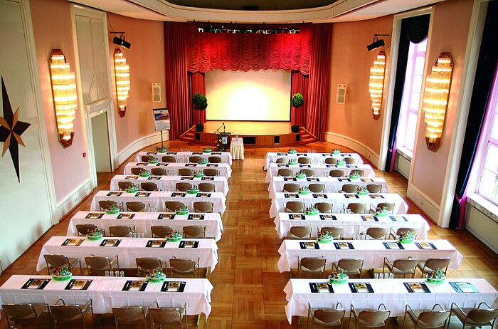 Historic lecture hall at Maritim Hotel Bad Wildungen with stage and daylight