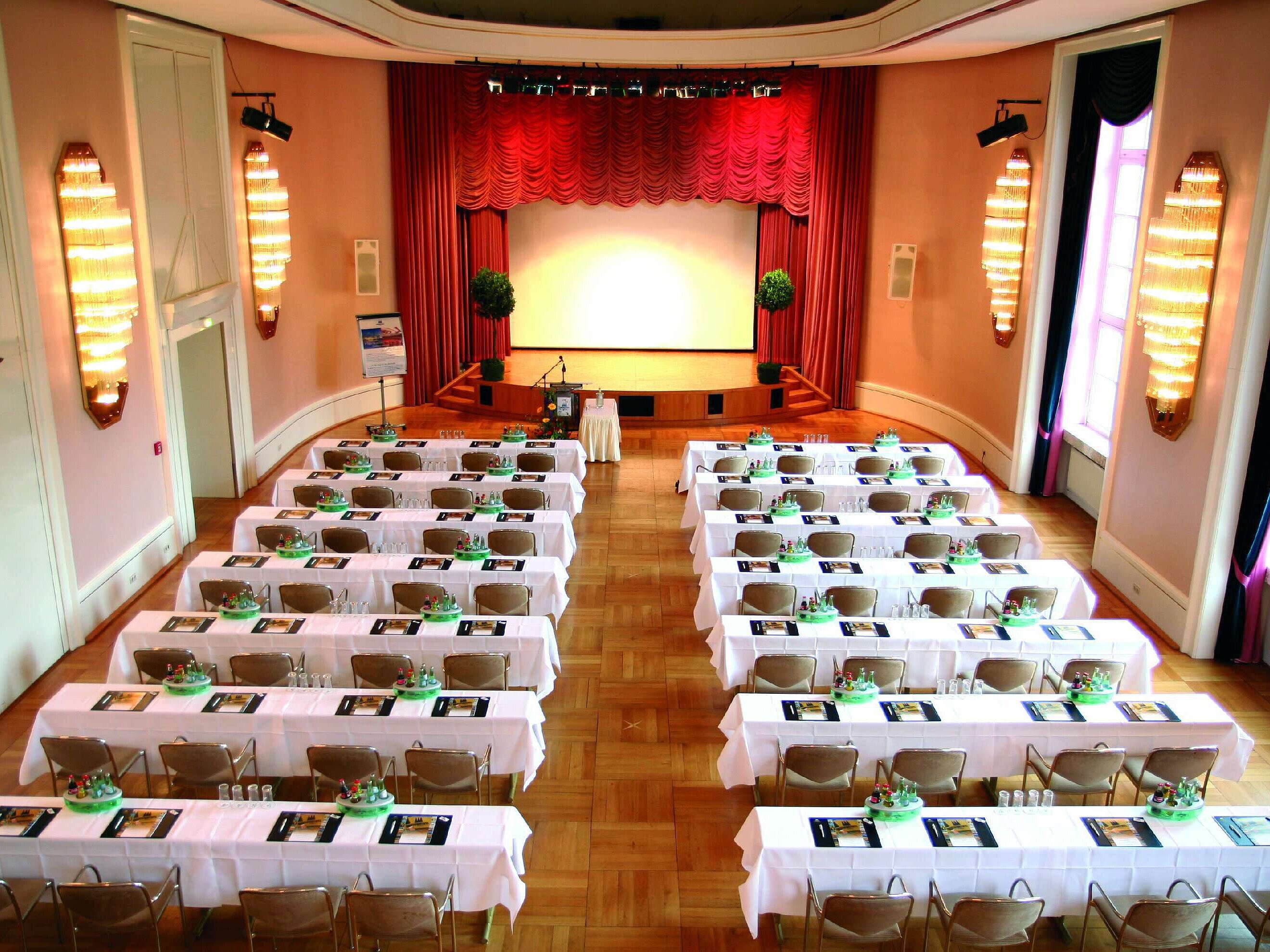 Historic lecture hall at Maritim Hotel Bad Wildungen with stage and daylight