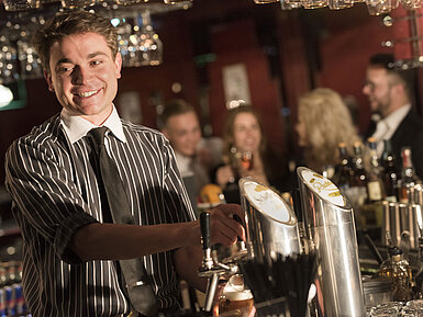 Life Style Bar  Friendly bartender serving drinks at the stylish bar of Maritim Hotel Frankfurt.