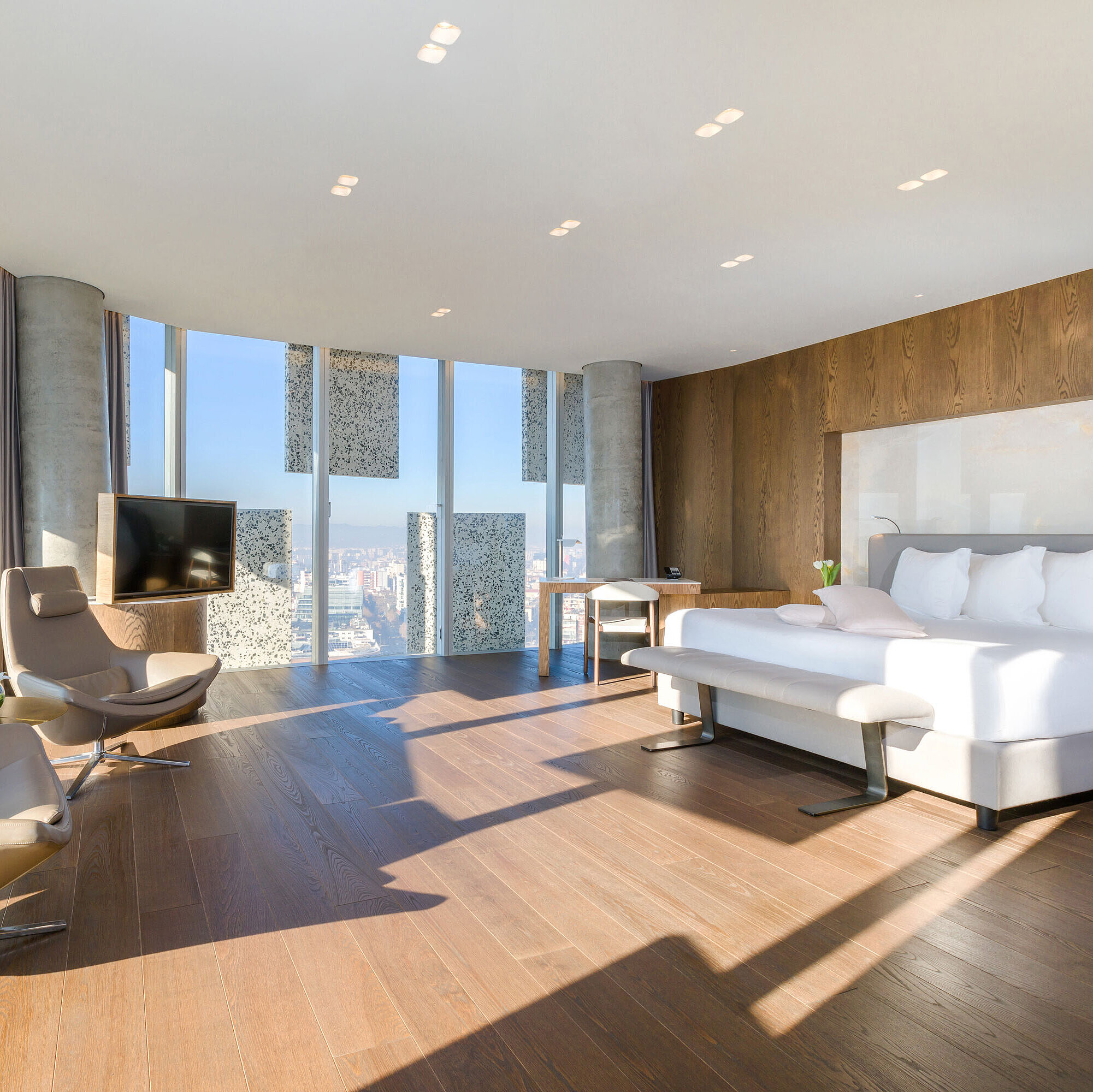 Room Bright panorama suite with city view and designer furniture at Maritim Hotel Plaza Tirana