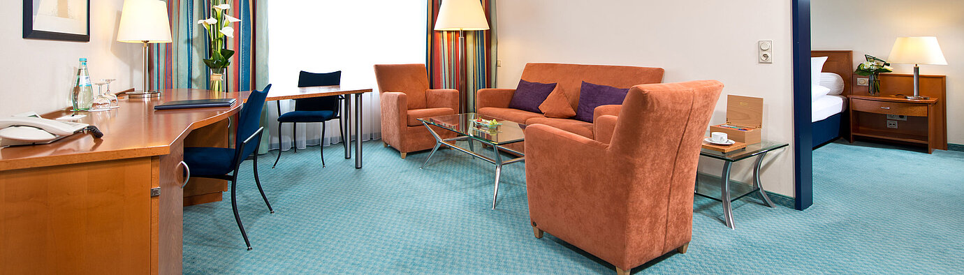 Master suite  Elegant master suite at Maritim Hotel Frankfurt with separate bedroom, spacious living room, and modern amenities.