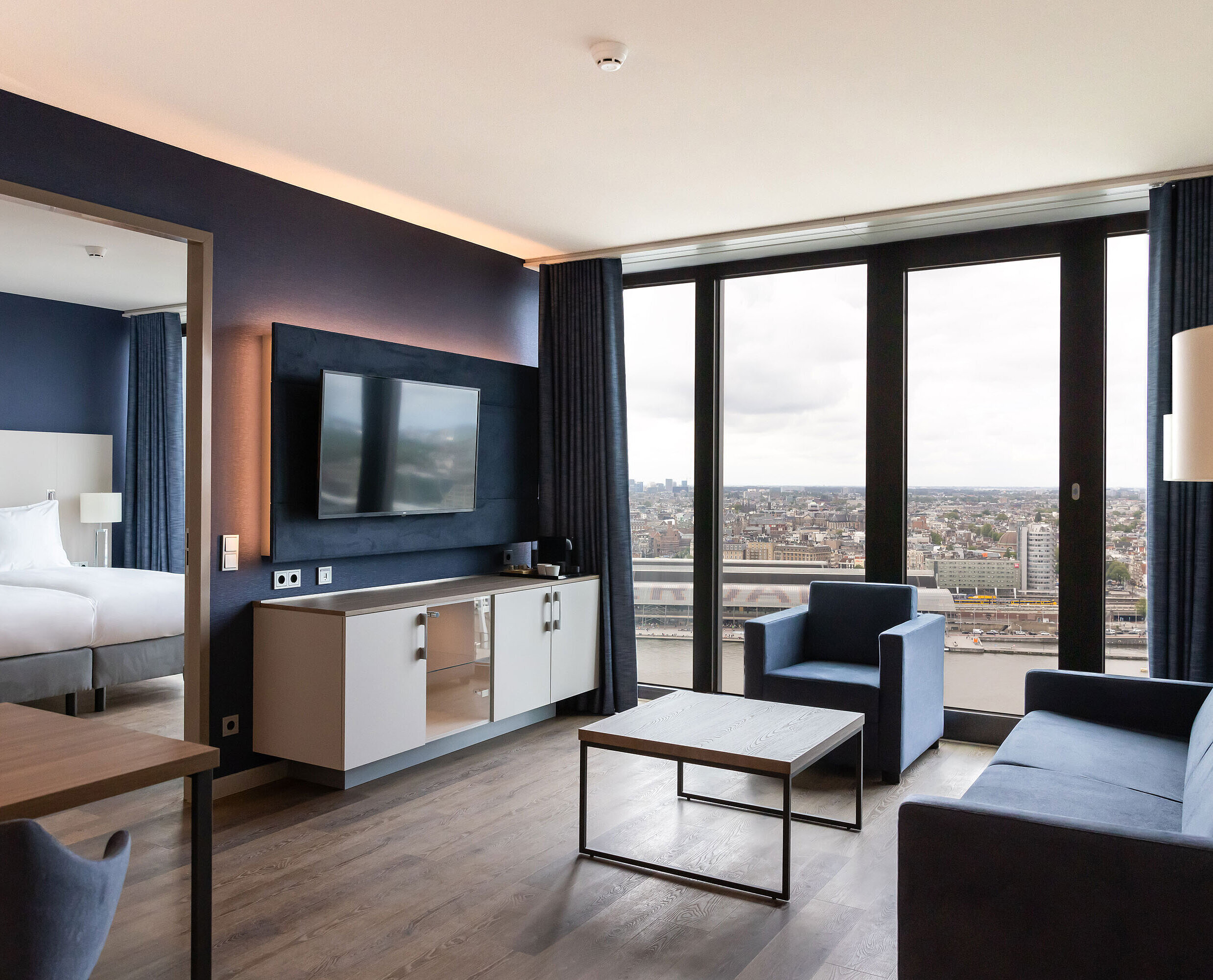 Living area with view Modern living area with city view and TV at Maritim Hotel Amsterdam