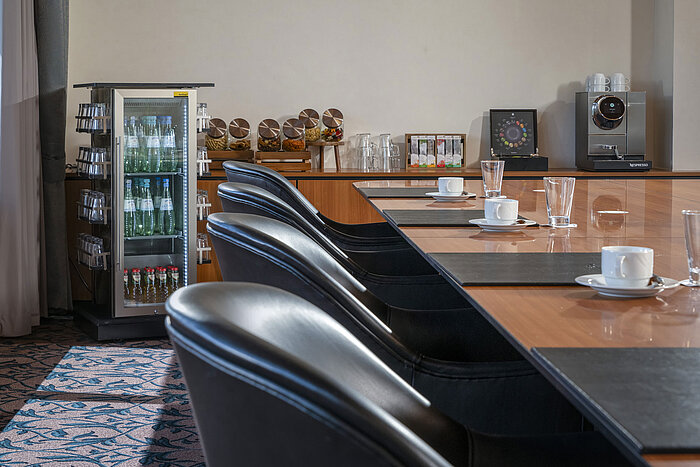 Meeting room with coffee machine, water, snacks and comfy chairs at Maritim Hotel Travemünde