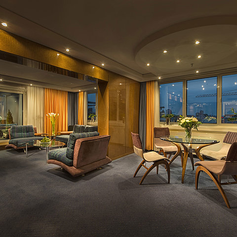 Elegant living room in the Presidential Suite at Maritim proArte Hotel Berlin with stylish lighting and view.