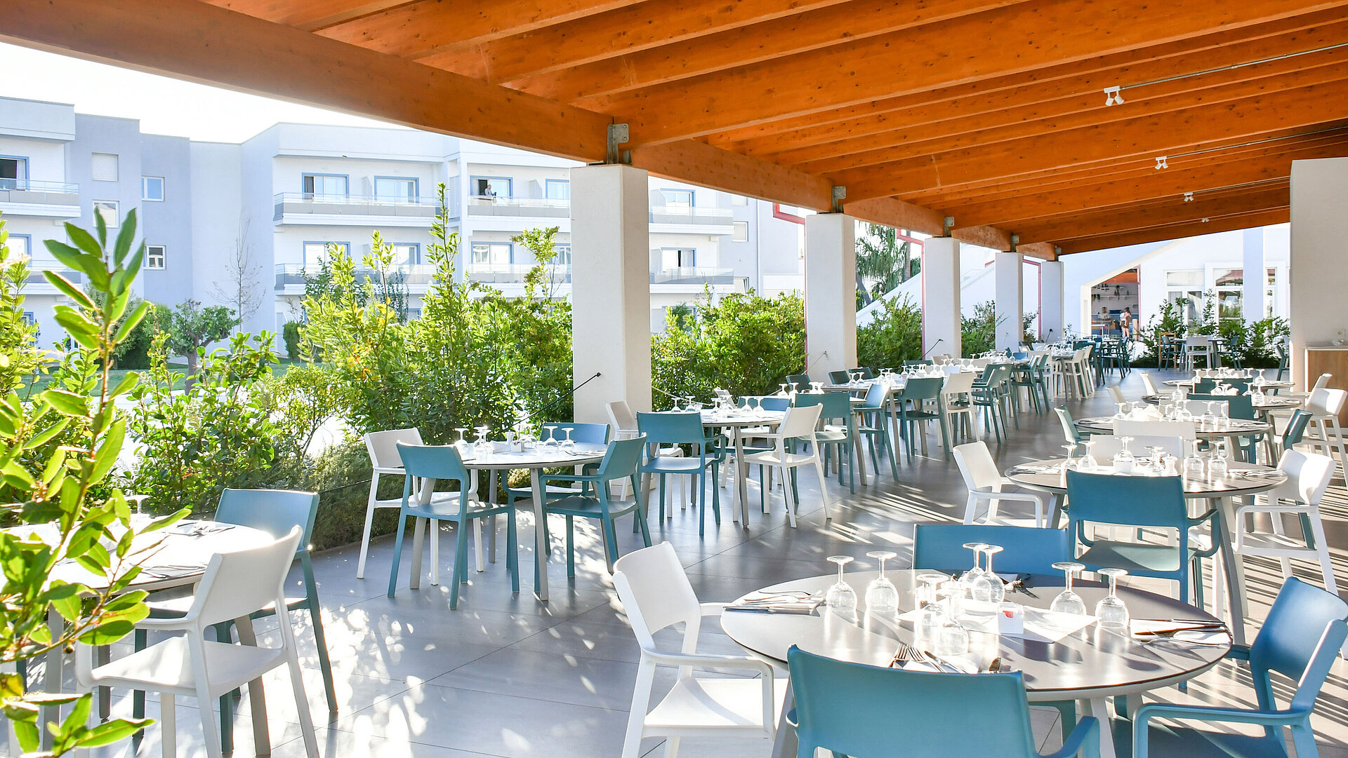 Covered terrace at Maritim Resort Calabria Bright covered outdoor restaurant area at Maritim Resort Calabria with set tables