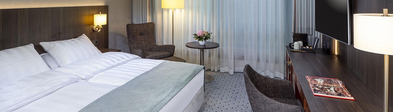 Superior Double room Modern Superior double room at Maritim Hotel Bremen with seating area, desk, and large window for natural light.