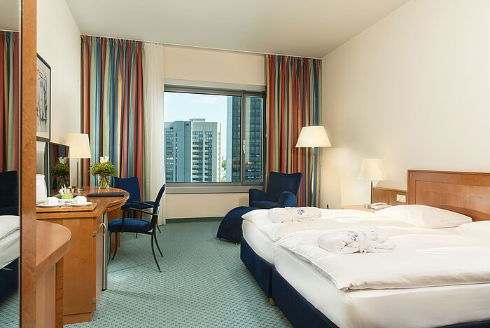 Superior Skyline room  Superior room at Maritim Hotel Frankfurt with double bed, desk, seating area, and skyline view.