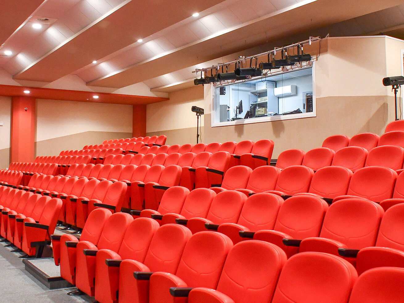 Theater Theatre hall with red seats and tech room at Maritim Resort Calabria